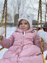 Portrait of girl sitting on hammock