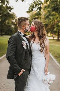 Wedding couple with face mask in covid-19 time