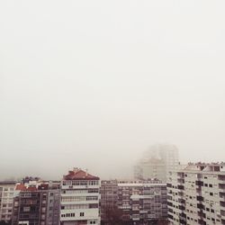 Cityscape against clear sky