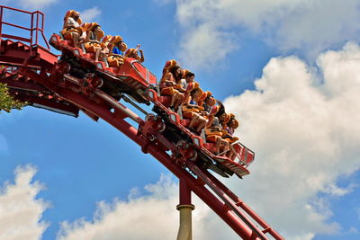 Low angle view of amusement park ride against sky