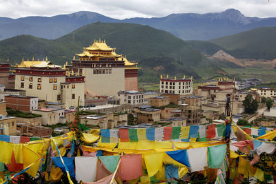 Buildings in city against sky