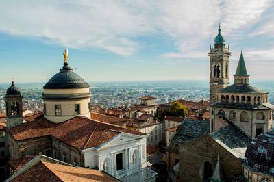 Cathedral in town against sky