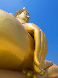 Close-up of statue against blue sky