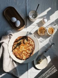 Delicious breakfast with pancakes, cream, butter and peanut butter