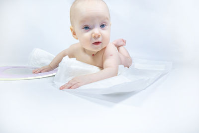 Portrait of cute baby girl on white background
