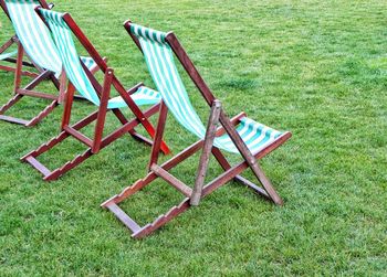 Empty chairs on field