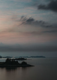 Scenic view of sea against sky at sunset