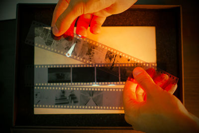 Cropped hand of man holding thermometer
