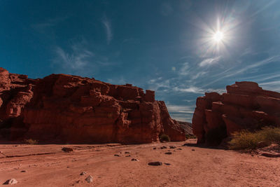 Panoramic view of rock formations on landscape against sky