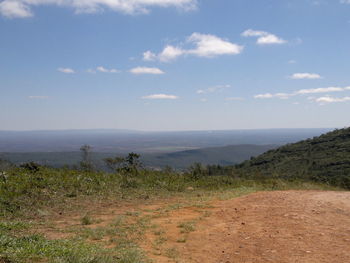 Scenic view of landscape against cloudy sky