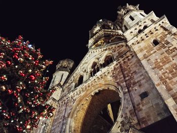 Low angle view of illuminated historic building at night