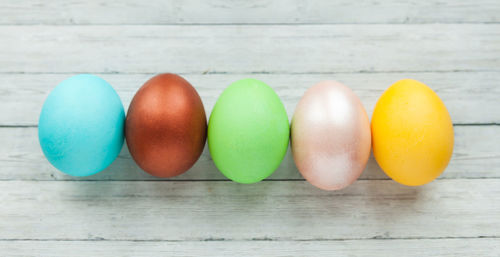 Directly above shot of multi colored eggs on table