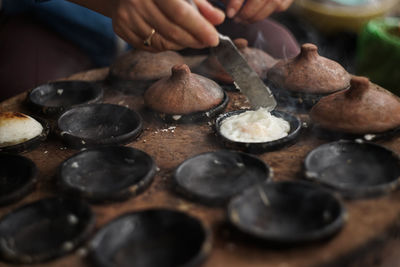 Midsection of person preparing food