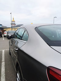 Car parked on road against sky