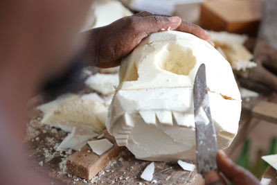 Close-up of hand holding ice cream