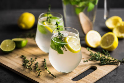 Lemonade in glasses on cutting board