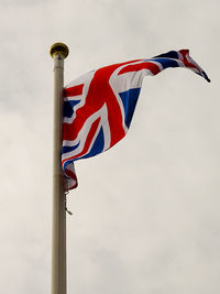 Low angle view of flag against sky