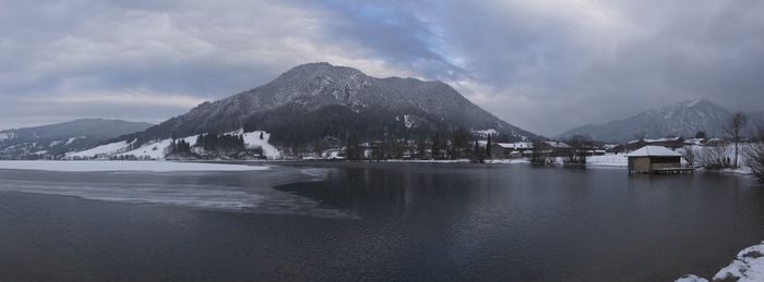 Scenic view of lake and mountains against sky