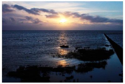 Scenic view of sunset over sea