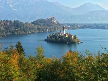 Scenic view of lake and mountains against sky