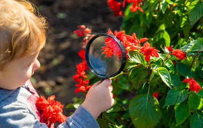 Portrait of girl holding flower