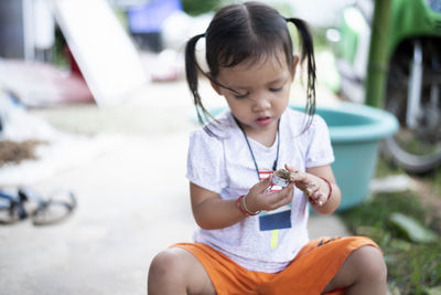 Close-up of cute girl eating food