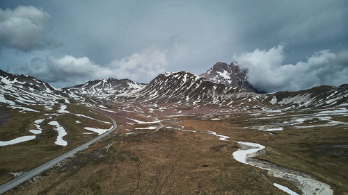 Scenic view of mountains against sky during winter