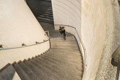 High angle view of man riding bicycle on staircase