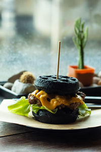 Close-up of burger in plate on table