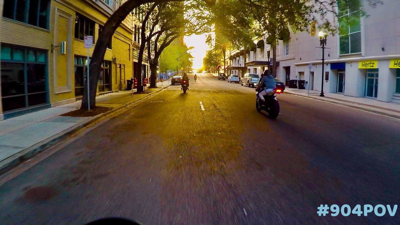 CAR ON STREET IN CITY