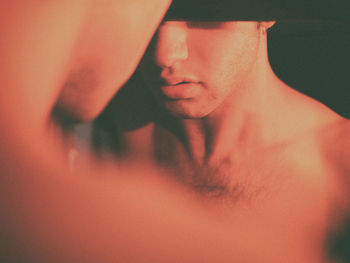 Close-up of shirtless young woman