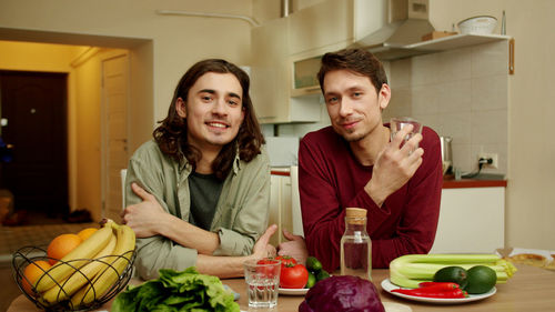 Portrait of smiling young couple at home