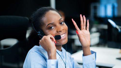 Portrait of young woman using mobile phone