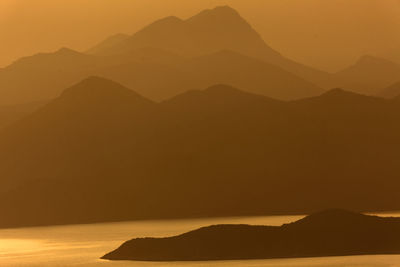 Scenic view of silhouette mountain against sky during sunset