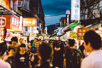 People on city street at night