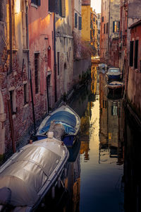 High angle view of canal amidst buildings