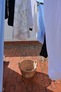 High angle view of basket amidst laundry drying outdoors