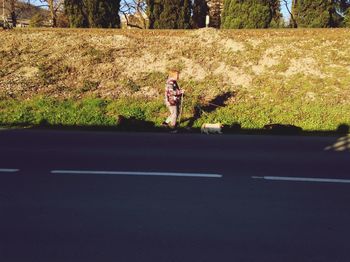 Woman standing on road