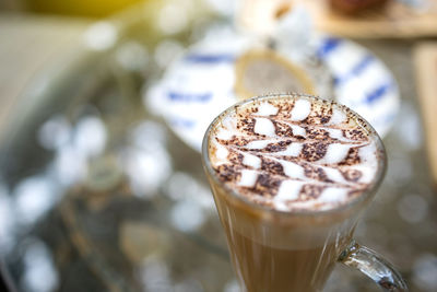 Close-up of cappuccino on table