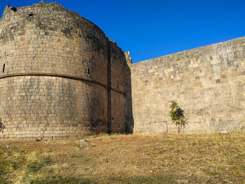 View of fort against clear blue sky