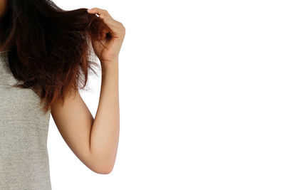 Rear view of woman standing against white background