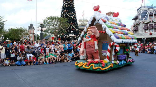 Crowd in traditional clothing against sky