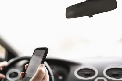 Person using phone while driving