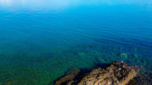 High angle view of sea and rocks