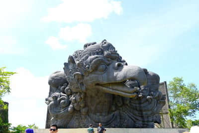 Low angle view of statue against sky