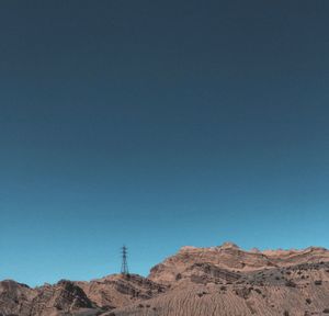 Scenic view of mountains against clear blue sky