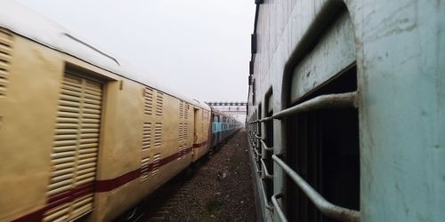 Train on railroad track against sky