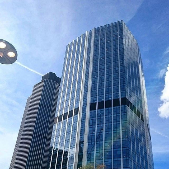 building exterior, architecture, low angle view, built structure, modern, office building, skyscraper, city, tall - high, reflection, glass - material, sky, tower, building, day, window, cloud - sky, no people, outdoors, tall