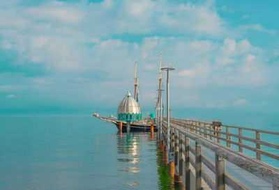 Sailboat on sea against sky