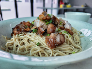 Close-up of noodles in bowl on table